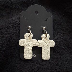 Sparkly white cross earrings
